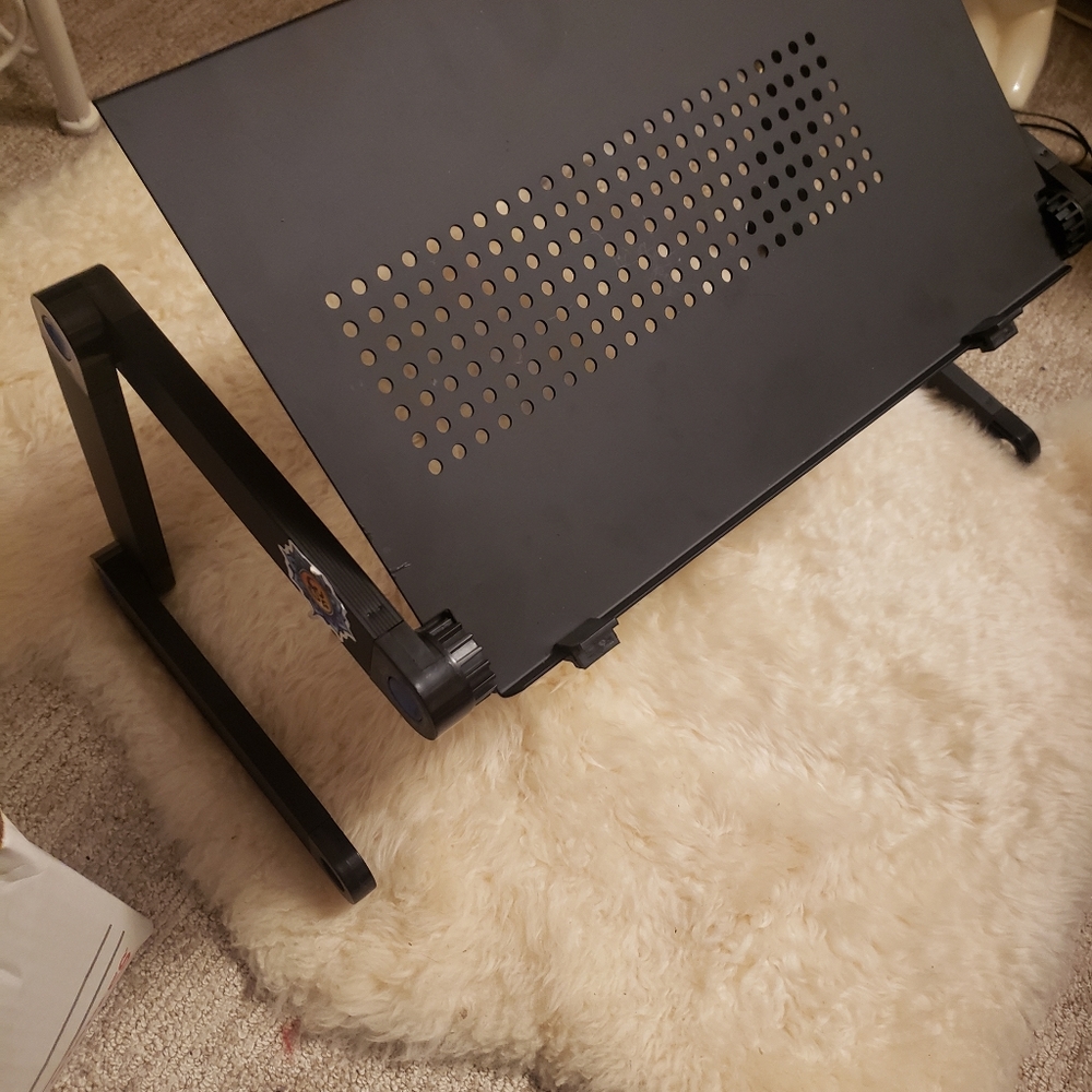 Laptop stand table holds up to 16 inch laptop